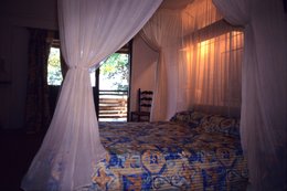 Archipel-des-Comores;-Chambre;-France;-Hébergement;-Intérieur;-Kaleidos;-Kaleidos-images;-La-parole-à-limage;-Laurent-Abad;-Lit;-Mayotte;-Moustiquaire;-Océan-Indien;-Stories-Pictures;-Terrasse